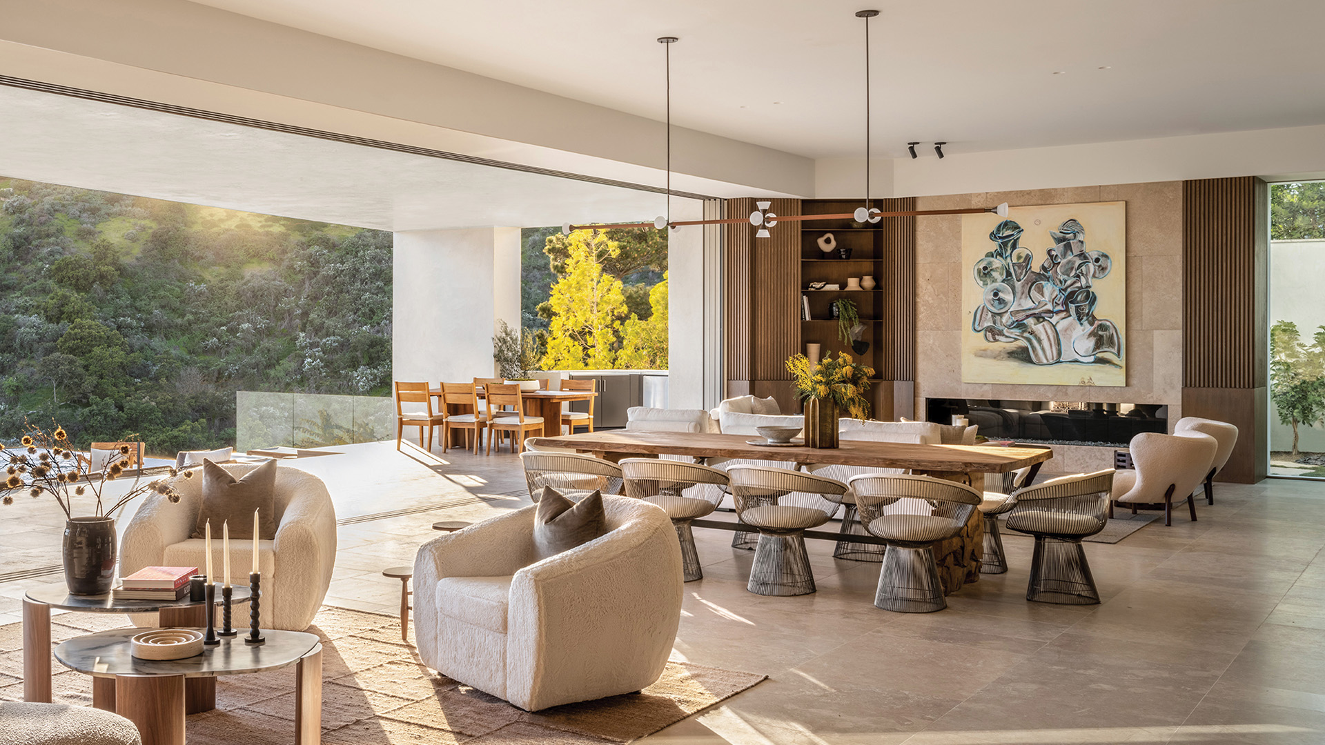 Floor-to-ceiling glass walls connect indoor and outdoor spaces