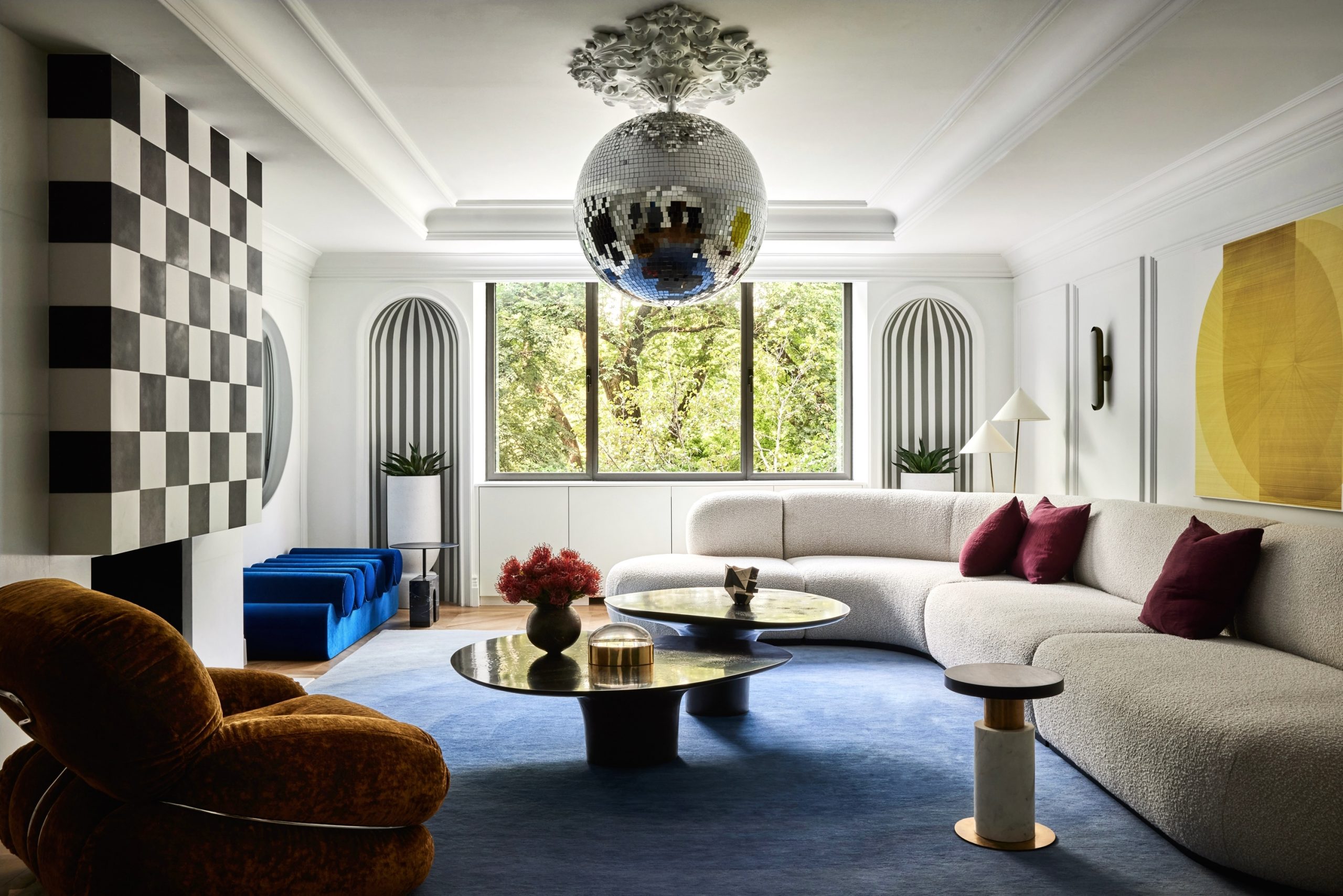 the 955 Fifth Avenue residence living room with a disco ball from the ceiling